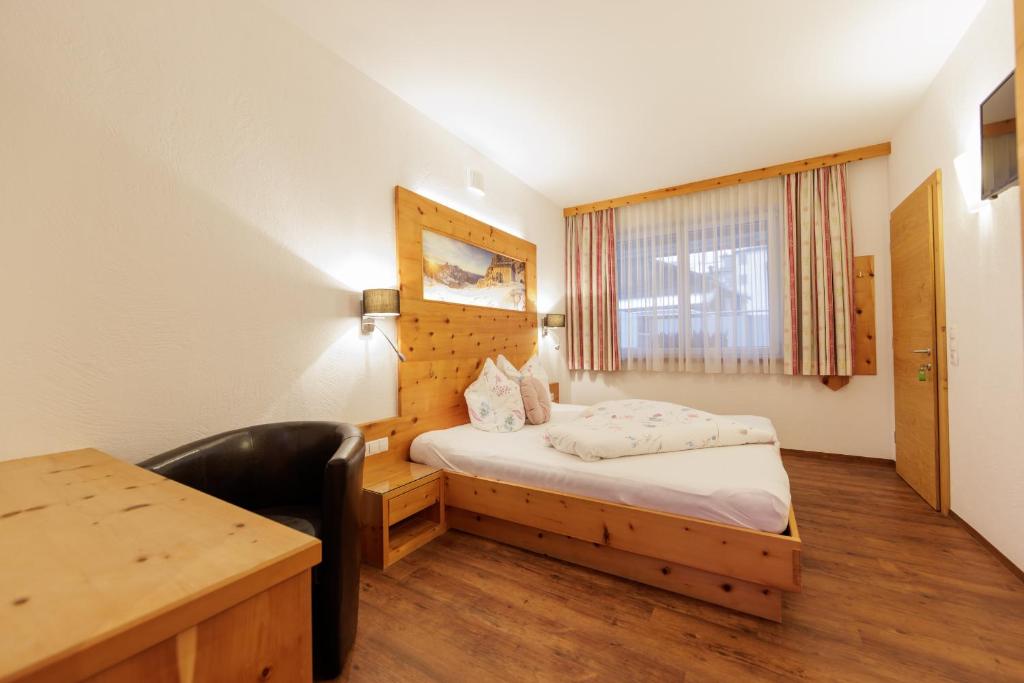 Postel nebo postele na pokoji v ubytování Apartmenthaus Goldeck