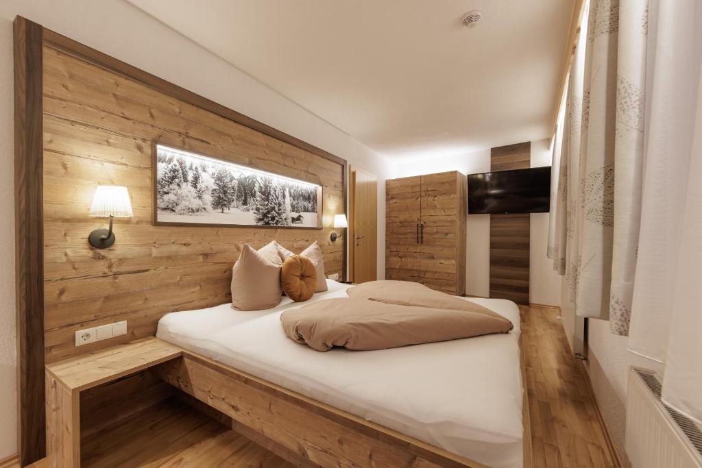 Postel nebo postele na pokoji v ubytování Apartmenthaus Goldeck