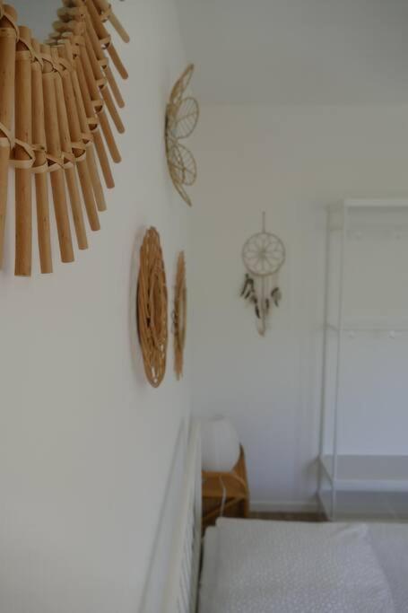 a room with a wall with clocks on the wall at Disneyland Paris, appartement 70m², parking privé in Serris