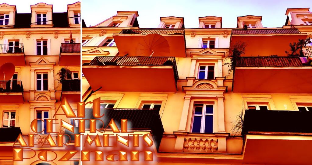 a building with a sign in front of it at Art Apartments in Poznań