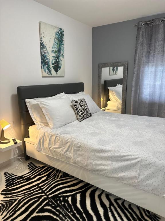 Posteľ alebo postele v izbe v ubytovaní Apartman Magnolija Umag