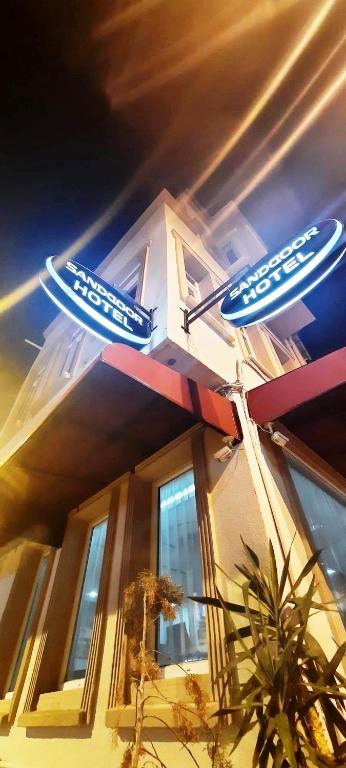 a street sign in front of a building at SAND DOOR HOTEL in Istanbul