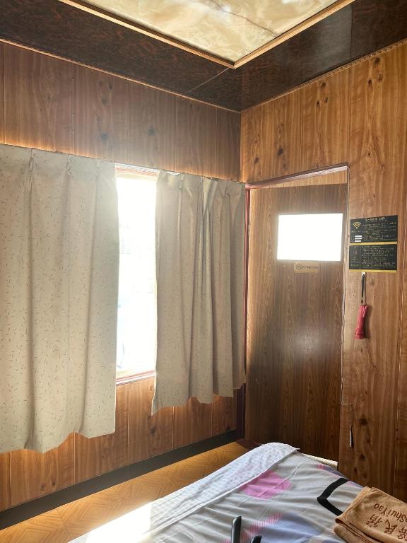 Postel nebo postele na pokoji v ubytování 水雲間民宿