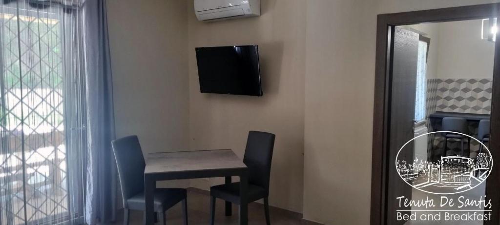 TV a/nebo společenská místnost v ubytování Tenuta De Santis