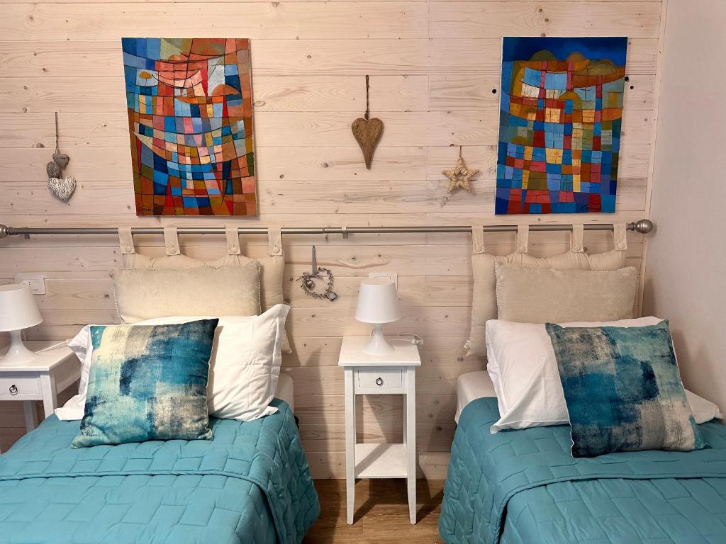 A bed or beds in a room at Amiter Bagni San Filippo