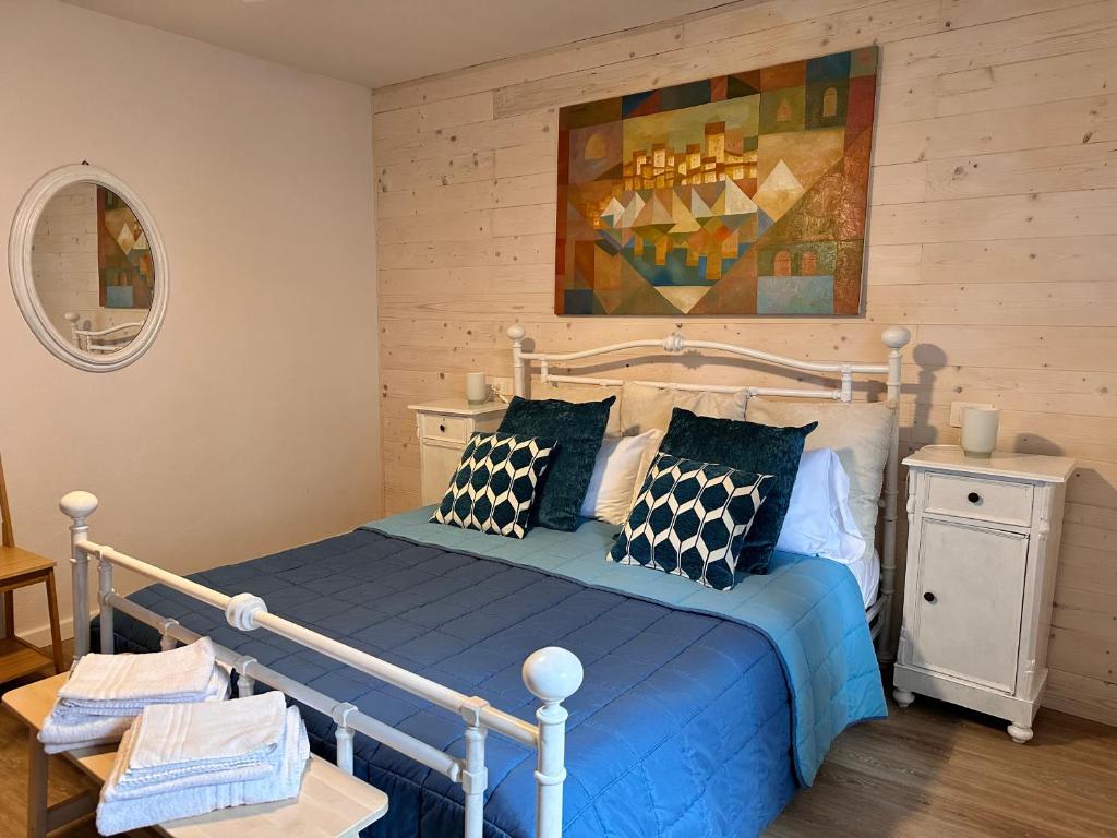 A bed or beds in a room at Amiter Bagni San Filippo