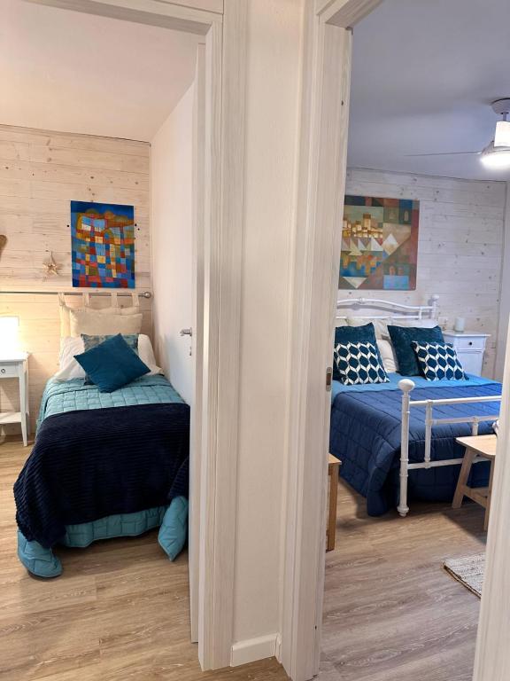 A bed or beds in a room at Amiter Bagni San Filippo