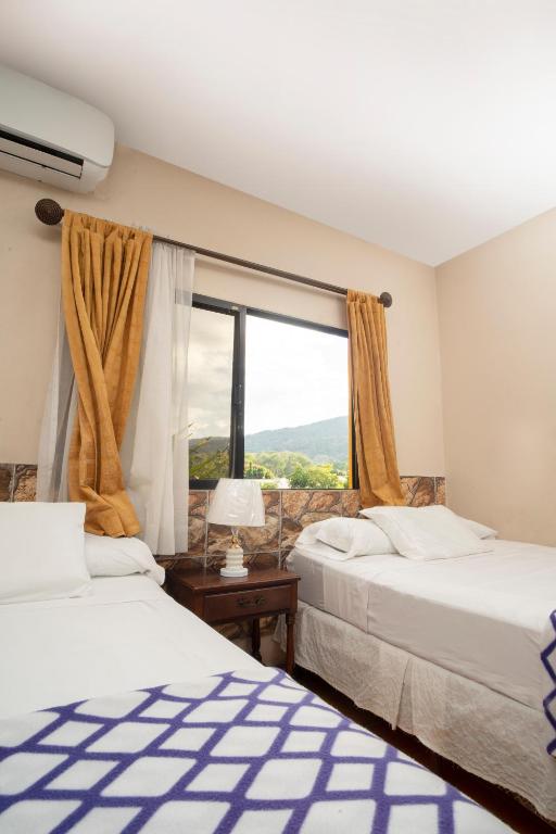 Postel nebo postele na pokoji v ubytování Apart hotel la Trejo