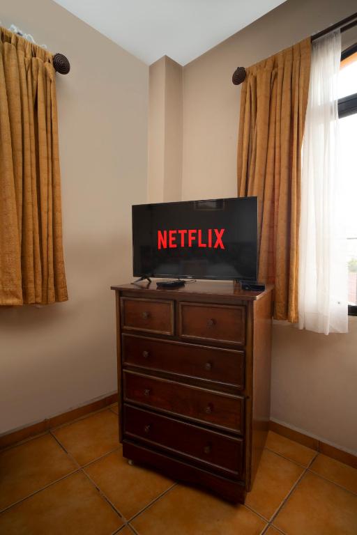 TV a/nebo společenská místnost v ubytování Apart hotel la Trejo