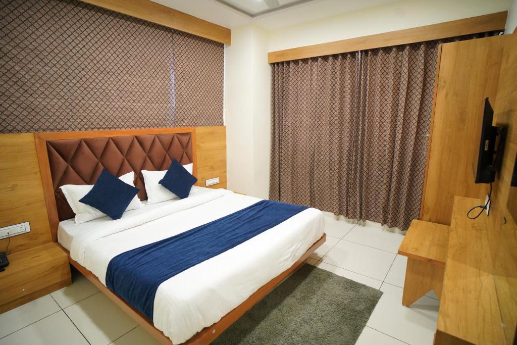 Postel nebo postele na pokoji v ubytování Hotel Suncity