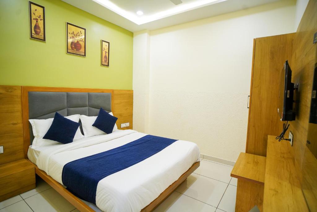 Postel nebo postele na pokoji v ubytování Hotel Suncity