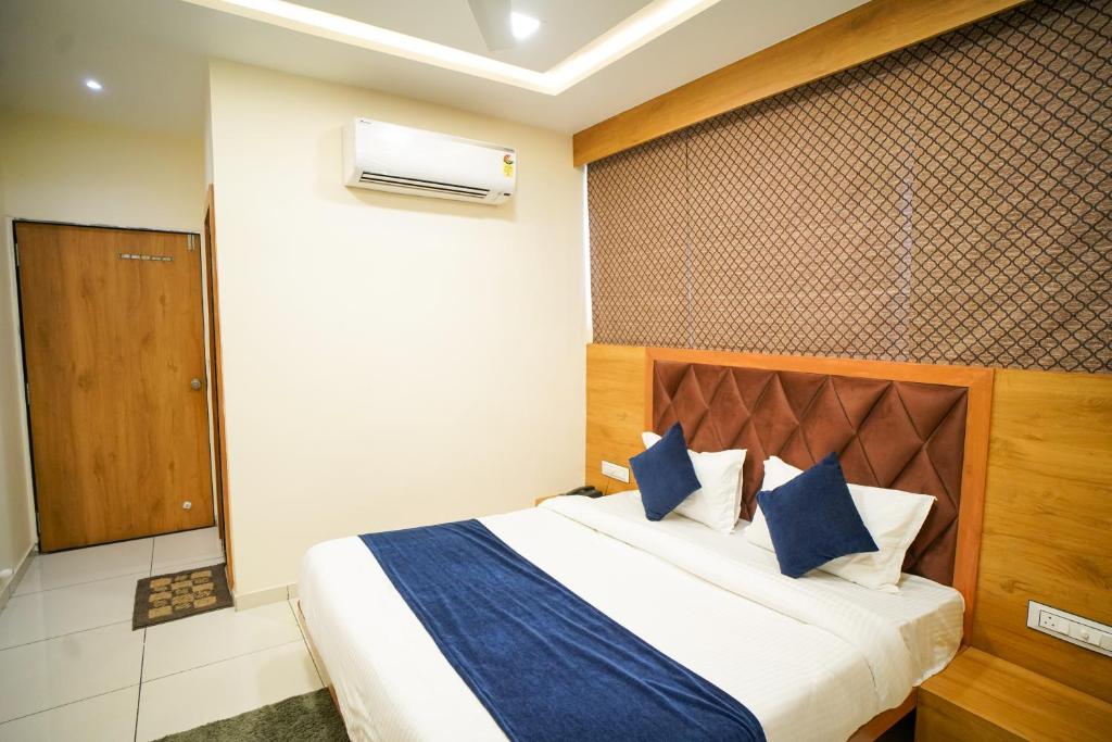 Postel nebo postele na pokoji v ubytování Hotel Suncity
