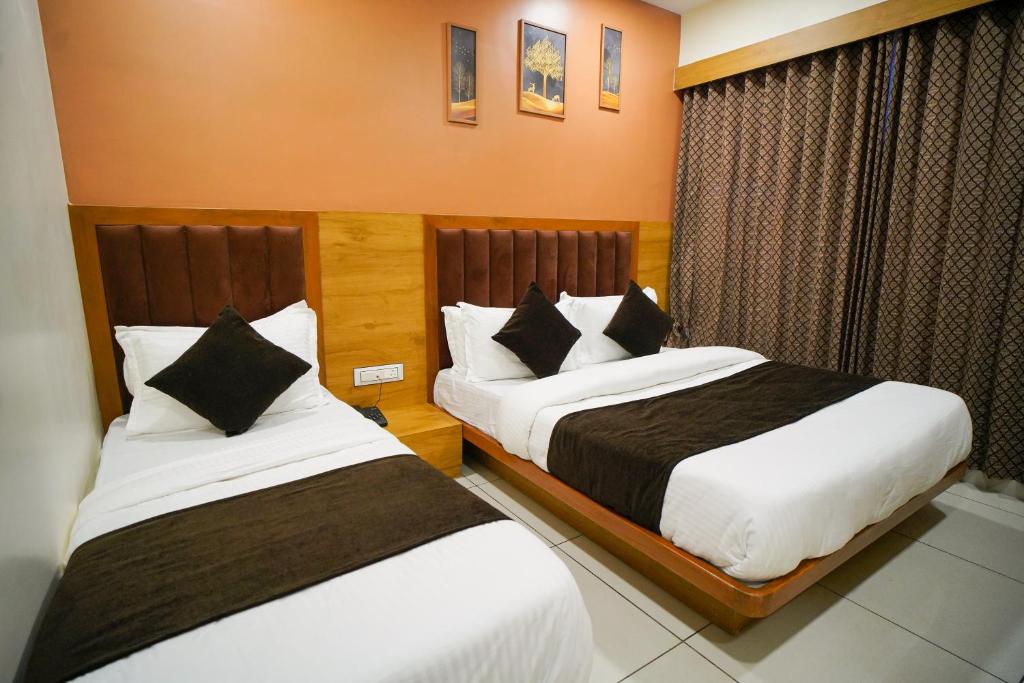 Postel nebo postele na pokoji v ubytování Hotel Suncity