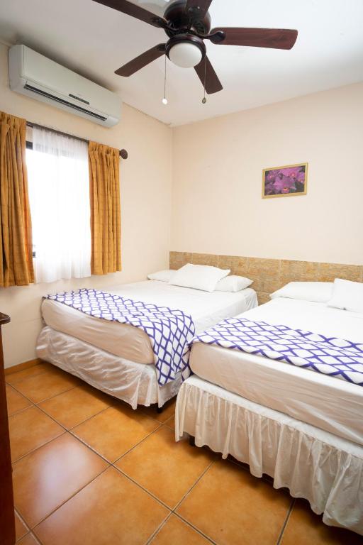 Postel nebo postele na pokoji v ubytování Apart hotel la Trejo