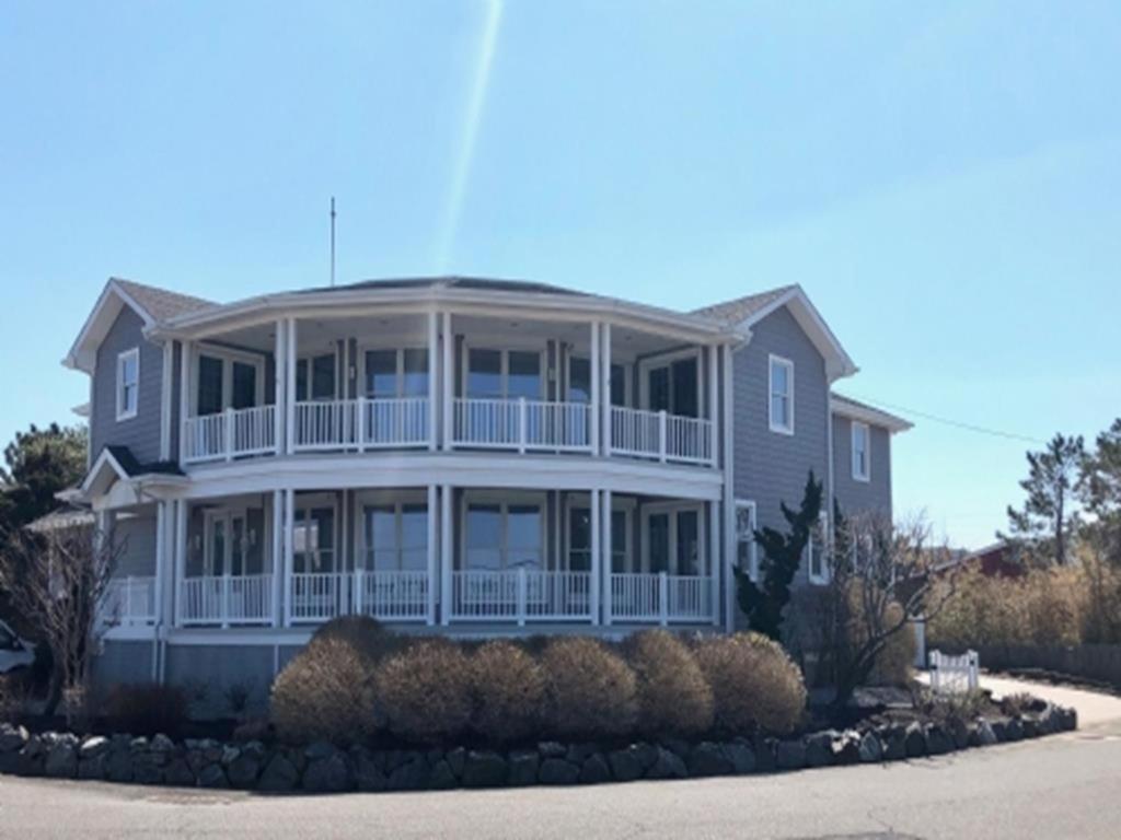 a large house with a large front porch at Gorgeous Bay Side Home! in Harvey Cedars