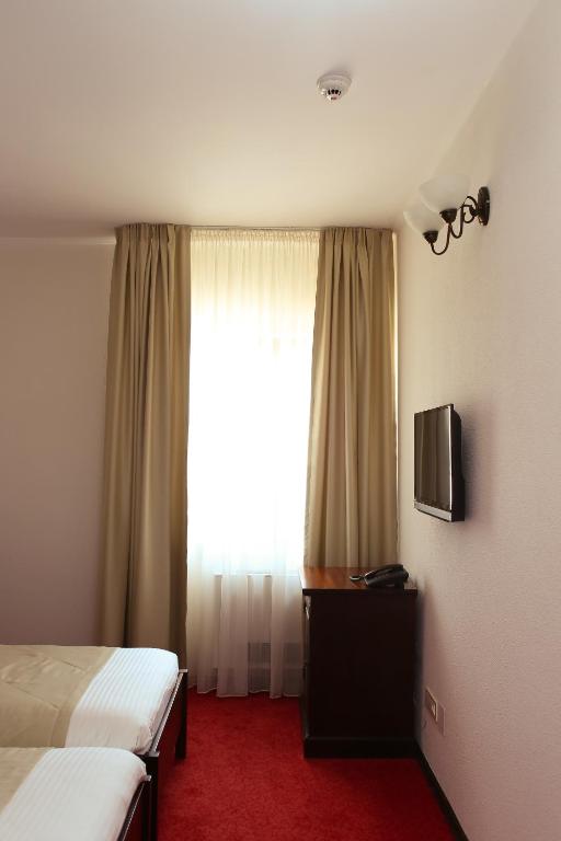 TV a/nebo společenská místnost v ubytování Hotel Bohemia