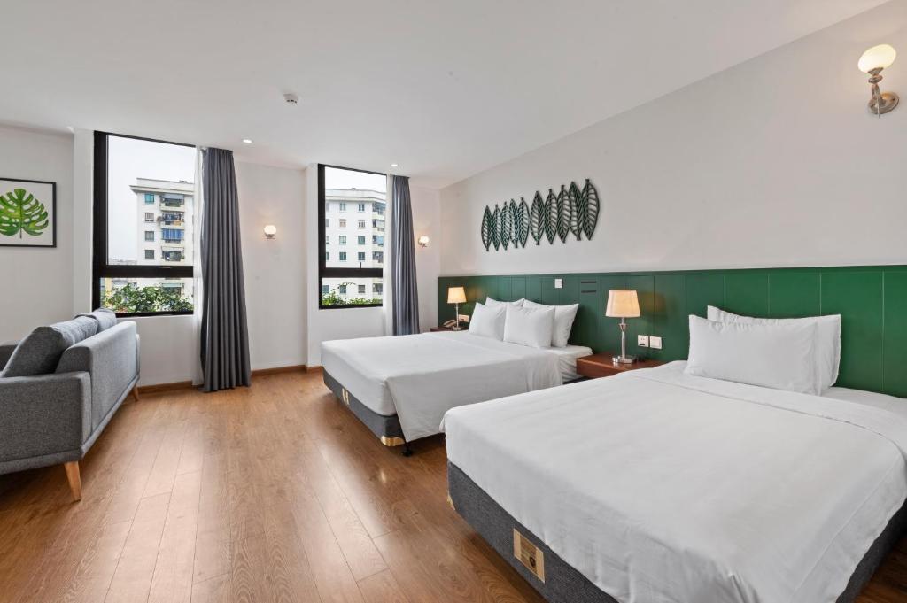Postel nebo postele na pokoji v ubytování Classic Hotel Hanoi