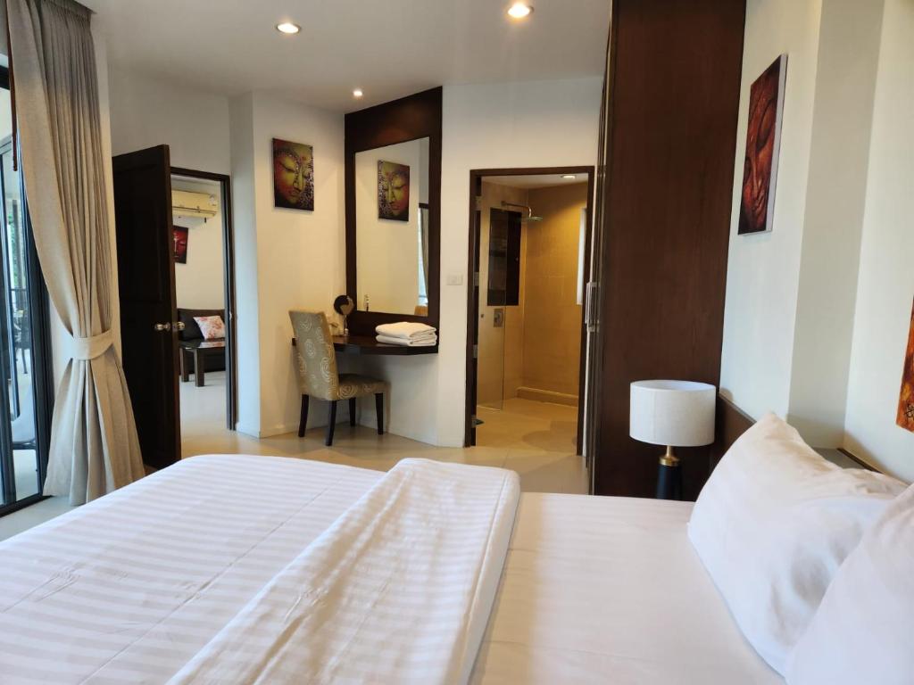Postel nebo postele na pokoji v ubytování TSE Residence [by Samui Emerald]