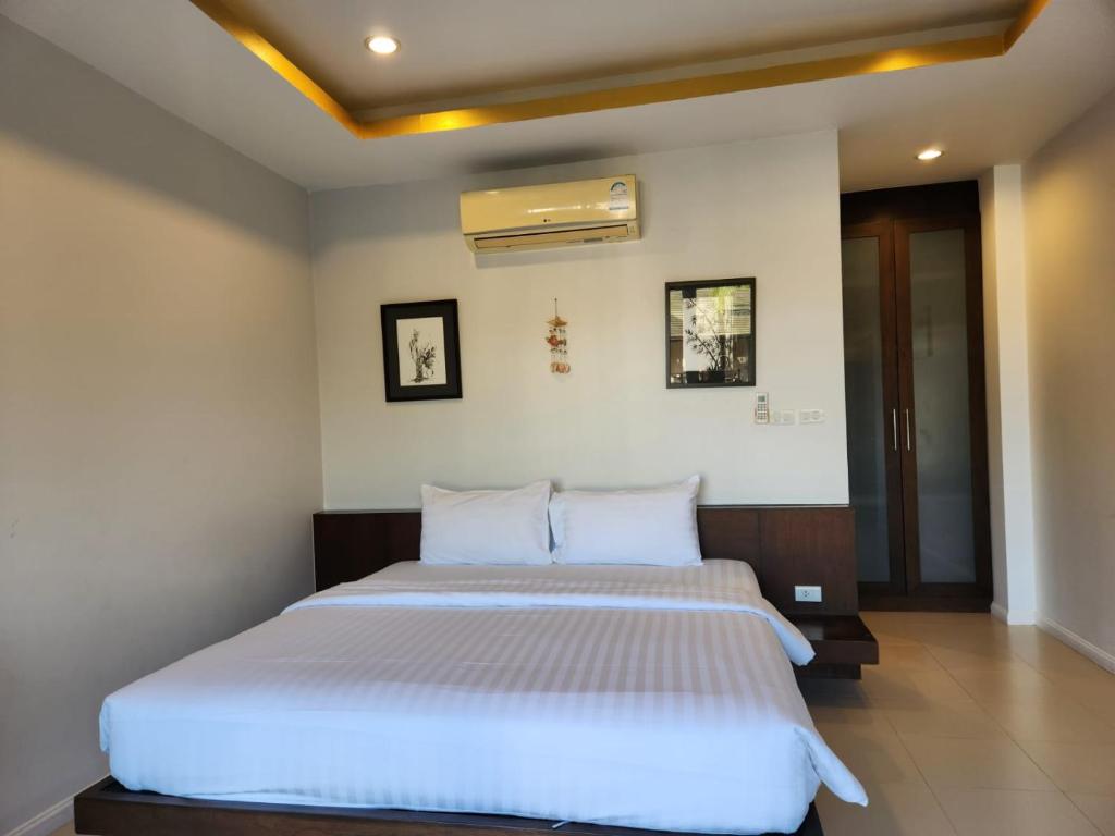 Postel nebo postele na pokoji v ubytování TSE Residence [by Samui Emerald]