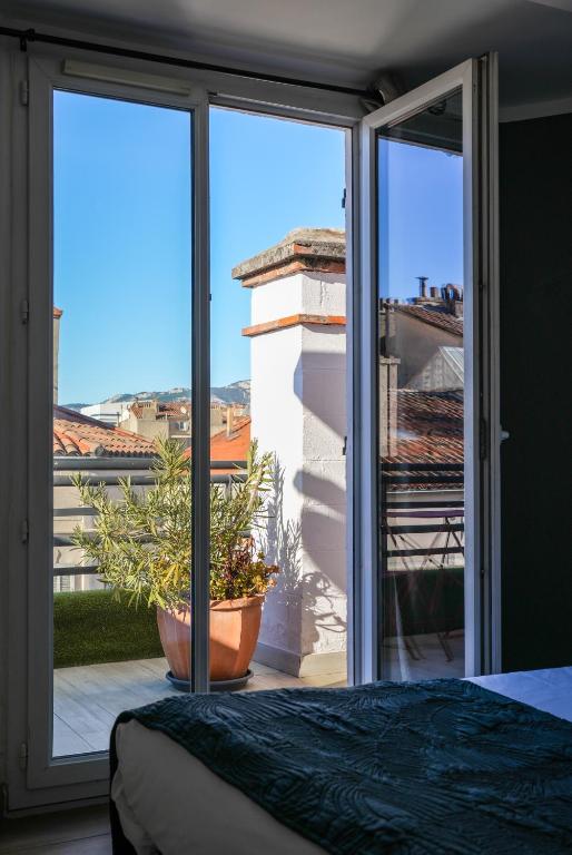 Postel nebo postele na pokoji v ubytování Celenya Hôtel