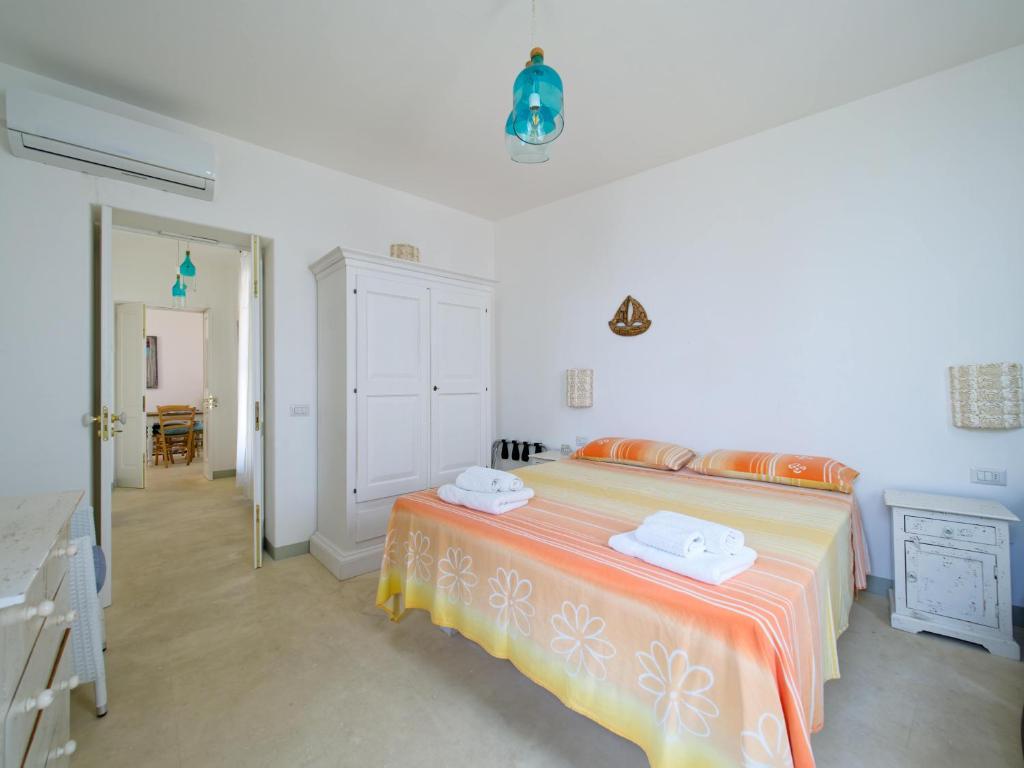 Postel nebo postele na pokoji v ubytování La Naca sul Mare - Suite