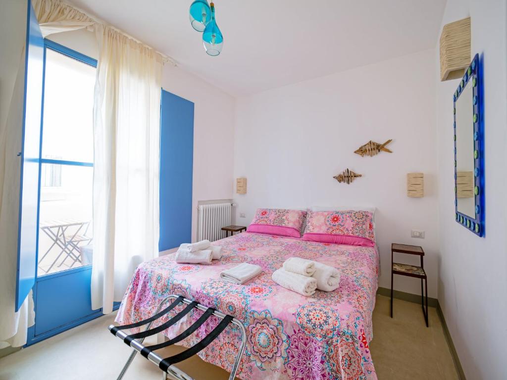 Postel nebo postele na pokoji v ubytování La Naca sul Mare - Suite