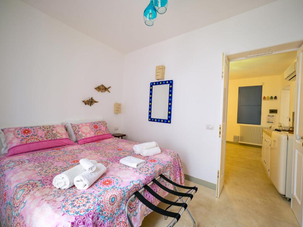 Postel nebo postele na pokoji v ubytování La Naca sul Mare - Suite
