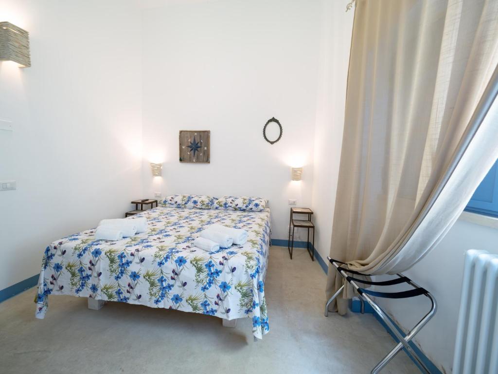 Postel nebo postele na pokoji v ubytování La Naca sul Mare - Suite