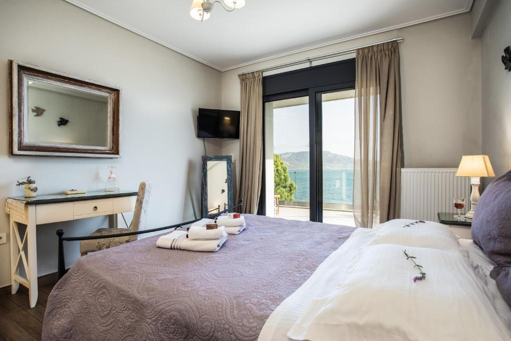 Postel nebo postele na pokoji v ubytování Villa Aggemari