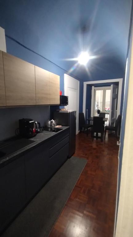 Kuchyň nebo kuchyňský kout v ubytování Plebiscito Suite Apartment