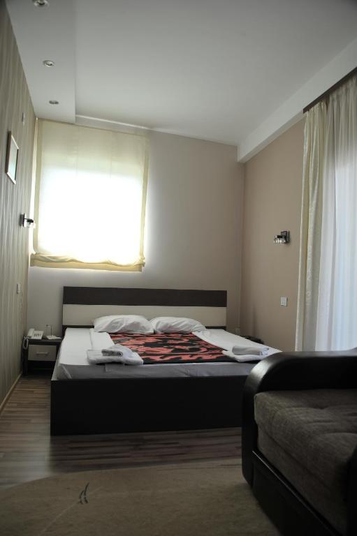 Postel nebo postele na pokoji v ubytování Hotel Zeleni Vir