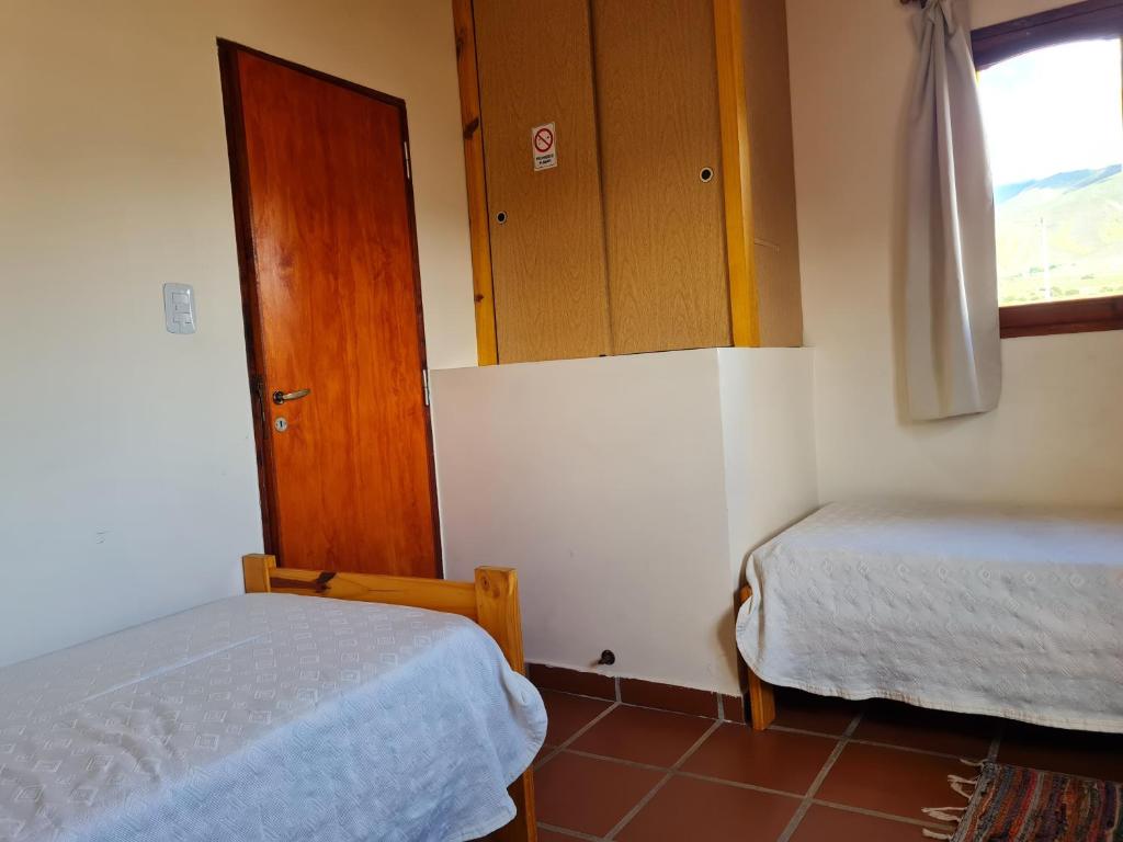 Postel nebo postele na pokoji v ubytování Cabañas Jacy