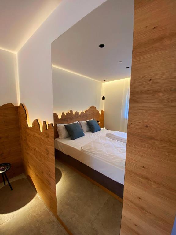 Postel nebo postele na pokoji v ubytování Chalet Larix Andalo Deluxe Apartments