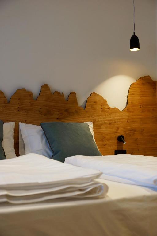 Postel nebo postele na pokoji v ubytování Chalet Larix Andalo Deluxe Apartments