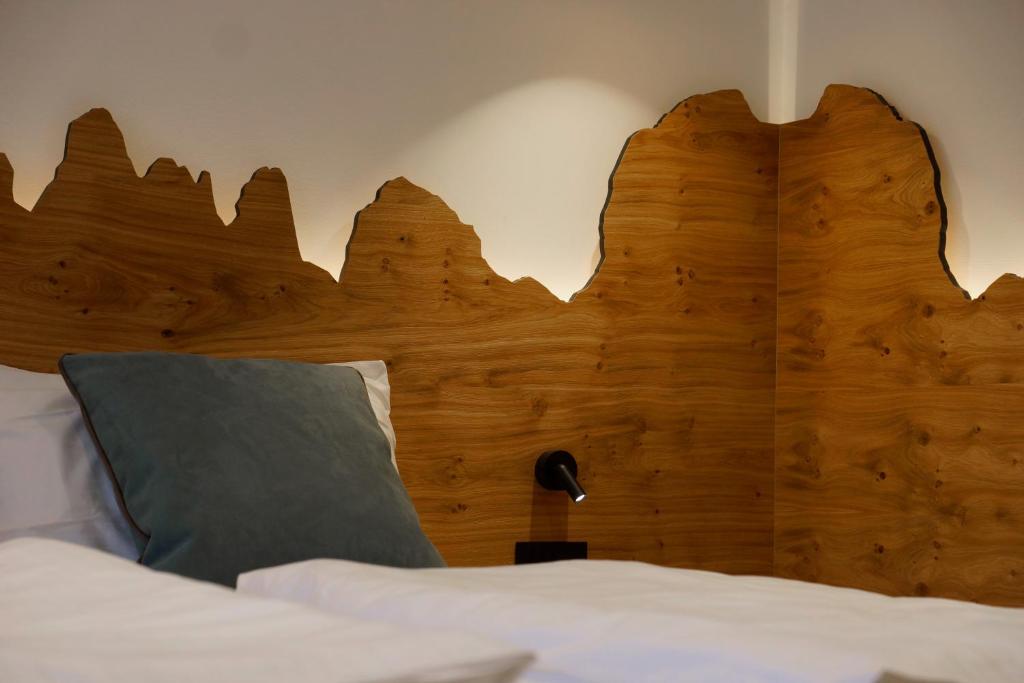 Postel nebo postele na pokoji v ubytování Chalet Larix Andalo Deluxe Apartments