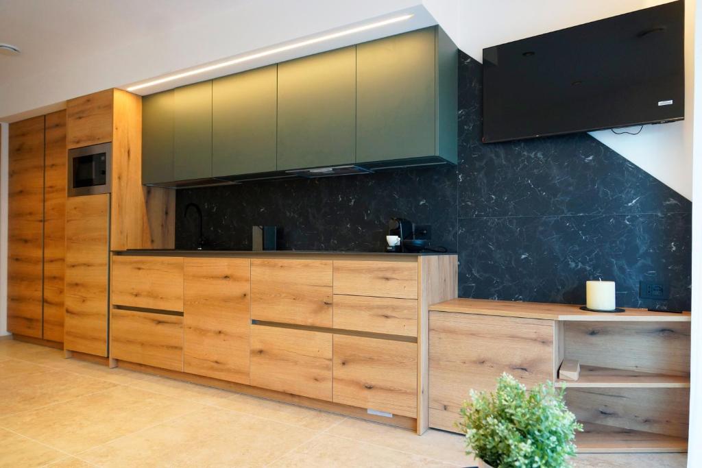 Kuchyň nebo kuchyňský kout v ubytování Chalet Larix Andalo Deluxe Apartments
