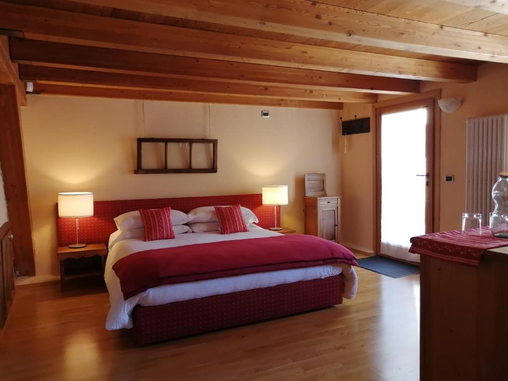 En eller flere senge i et værelse på La Thuillettaz