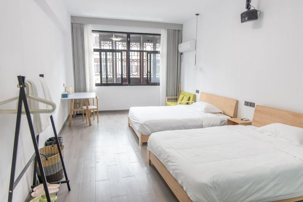 Postel nebo postele na pokoji v ubytování Hetao B&B