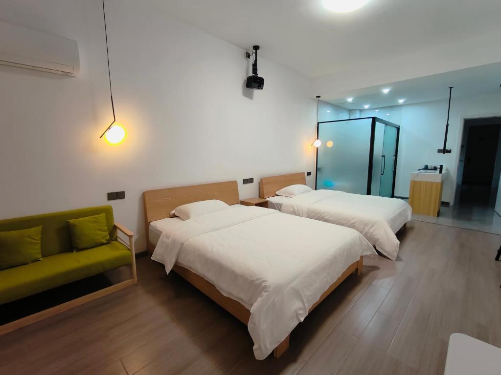 Postel nebo postele na pokoji v ubytování Hetao B&B