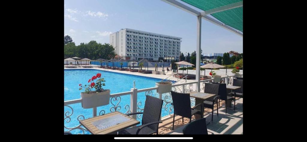 a view of a swimming pool from a balcony at De Lux Nedeljkovic President in Jagodina