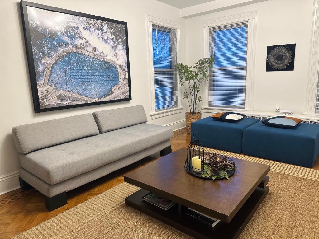 a living room with a couch and a coffee table at Beautiful 2BR apt in Beach community, Close to Train and hwys! ONLY 1 hr to NYC! in Norwalk