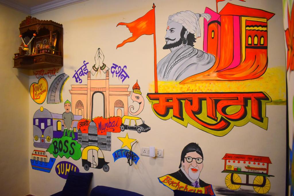 a room with a wall covered in graffiti at Prince Solo Hostel in Mumbai