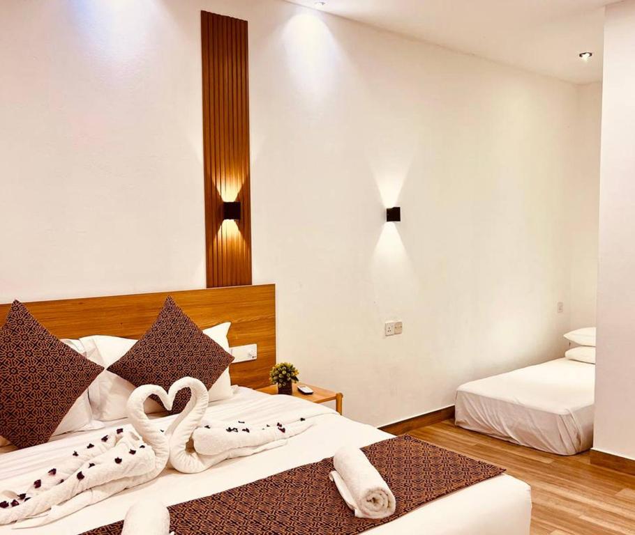 Postel nebo postele na pokoji v ubytování Kihaa Holiday Home
