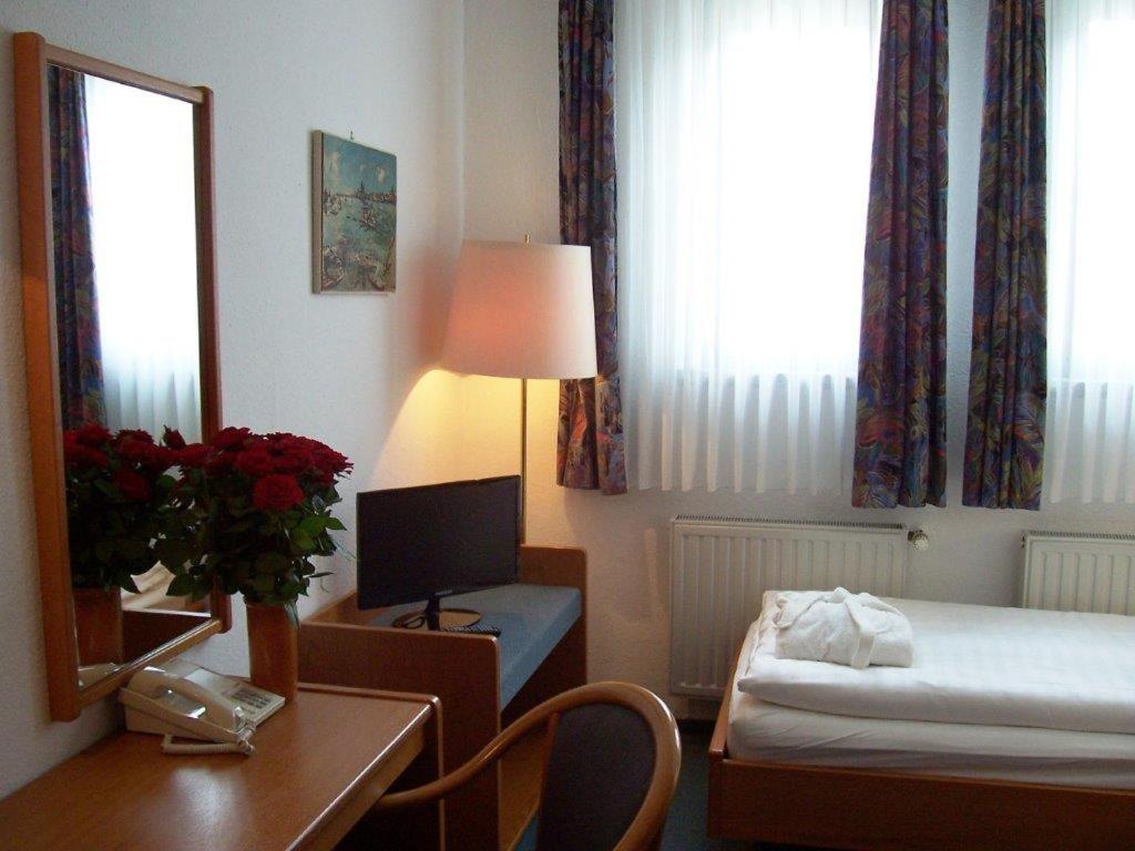 Postel nebo postele na pokoji v ubytování Hotel Vogtland