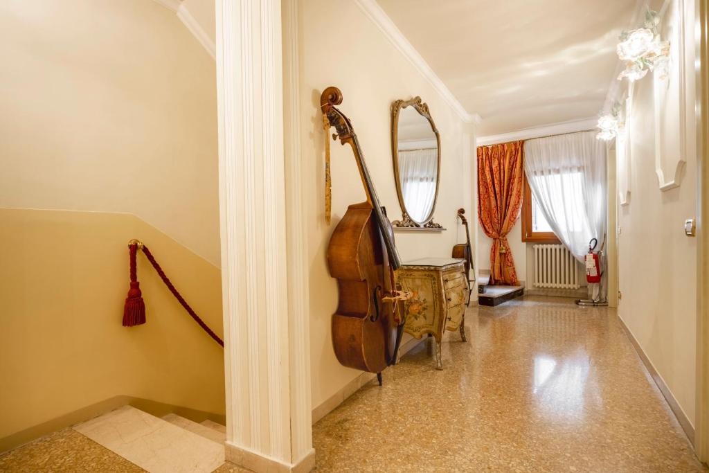 Un ou plusieurs lits dans un hébergement de l'établissement Locanda Al Leon