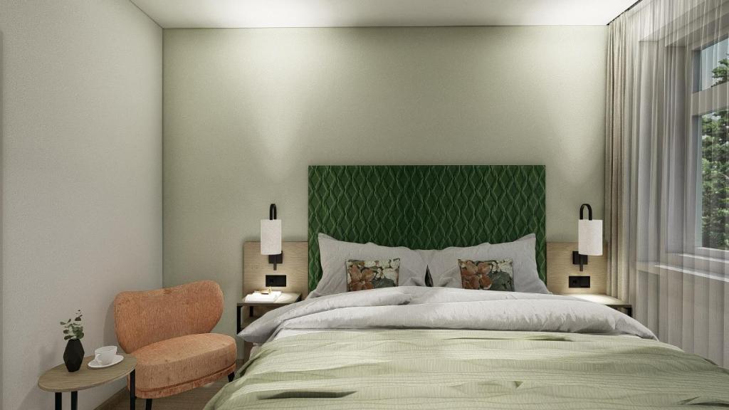 Postel nebo postele na pokoji v ubytování Hotel Vogtland