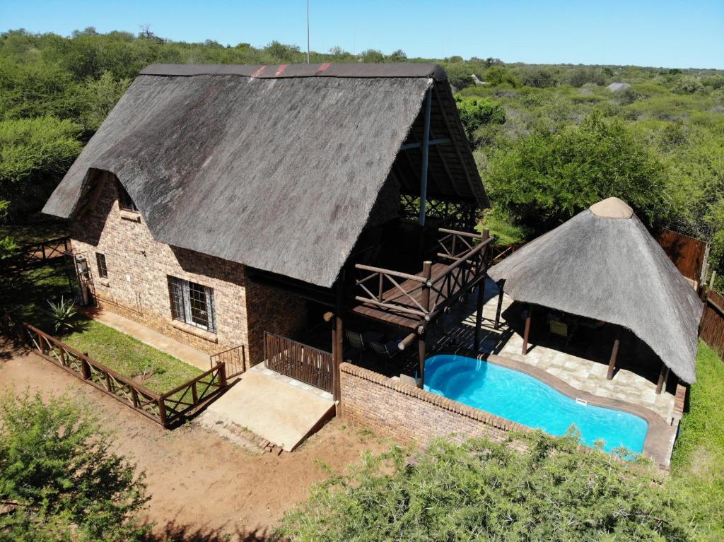 an aerial view of a house with a swimming pool at Giraffe plains in Marloth Park