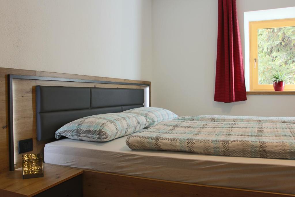 Postel nebo postele na pokoji v ubytování Ciasa Alfri