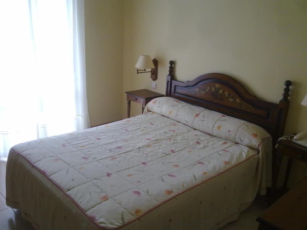Posteľ alebo postele v izbe v ubytovaní Hotel Cortijo
