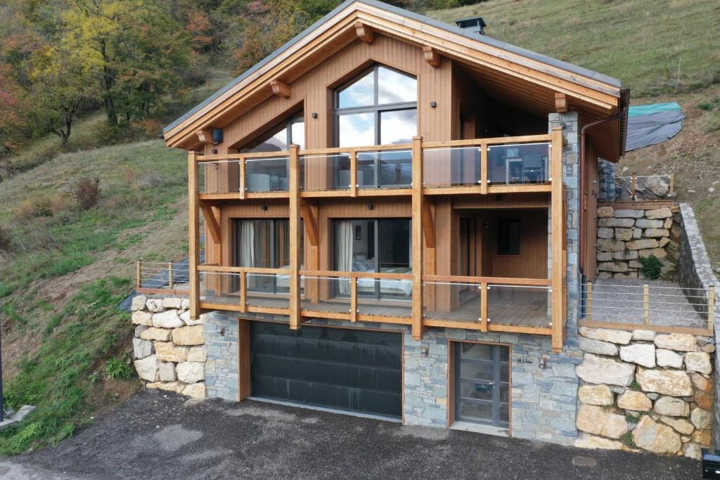 a house on a hill with a garage at Chalet La Tarine 